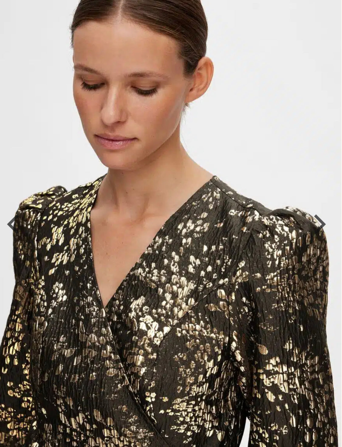 Last item | Textured gold mini dress with puffed shoulder.