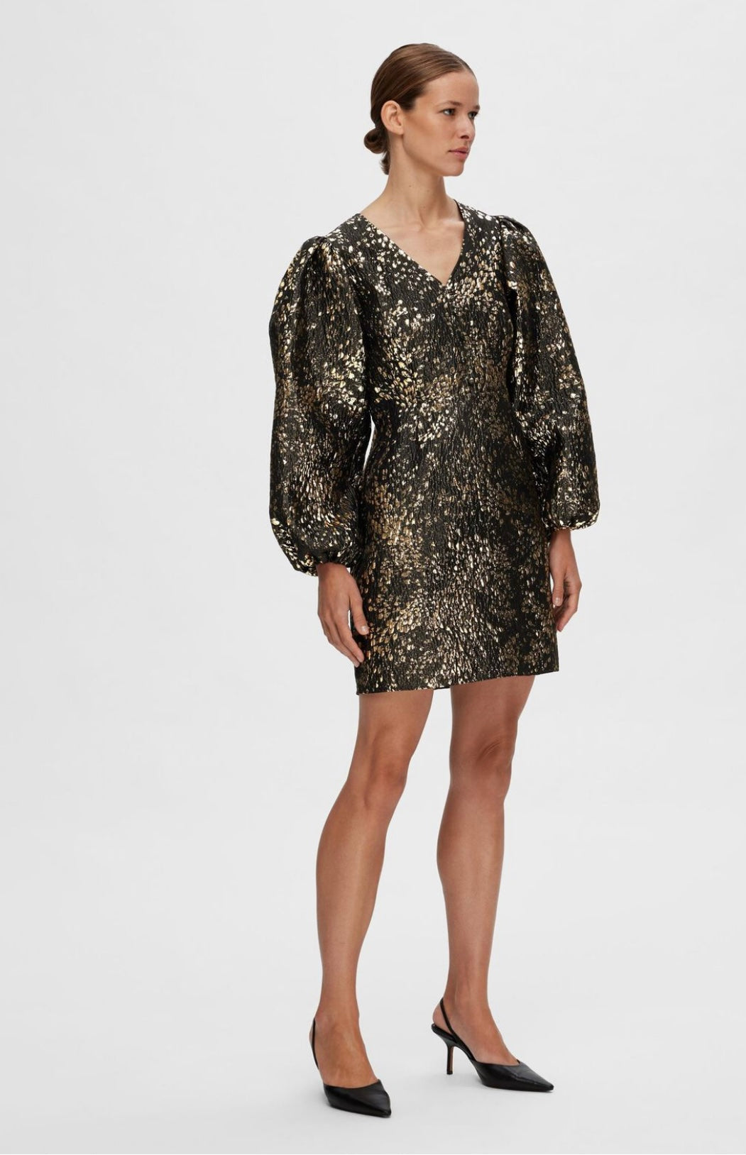 Last item | Textured gold mini dress with puffed shoulder.