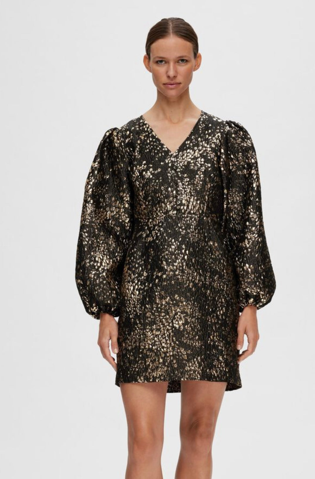 Last item | Textured gold mini dress with puffed shoulder.
